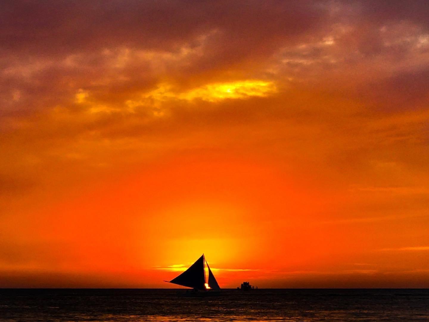 footprints thefatgoddess boracay sunset with sailboat